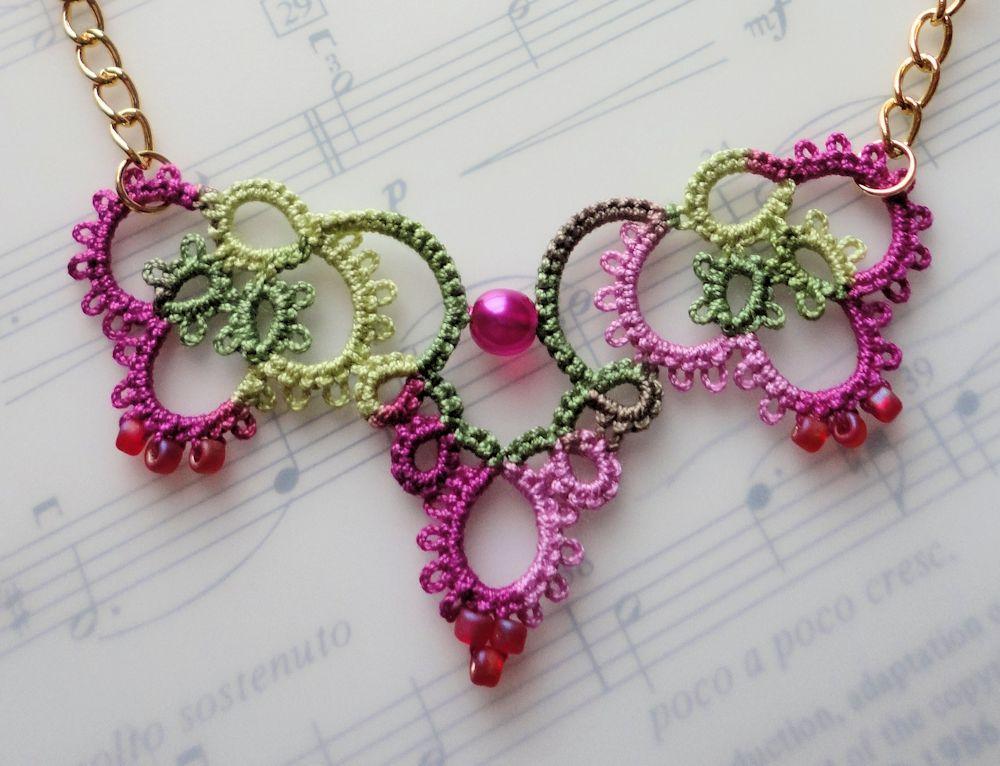crochet jewelry patterns pink crochet necklace laying on music book FOVYKWH