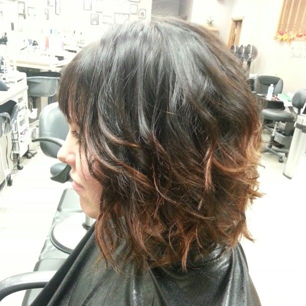Dark brown color with a copper ombre effect. Short hair. Bob. Bangs